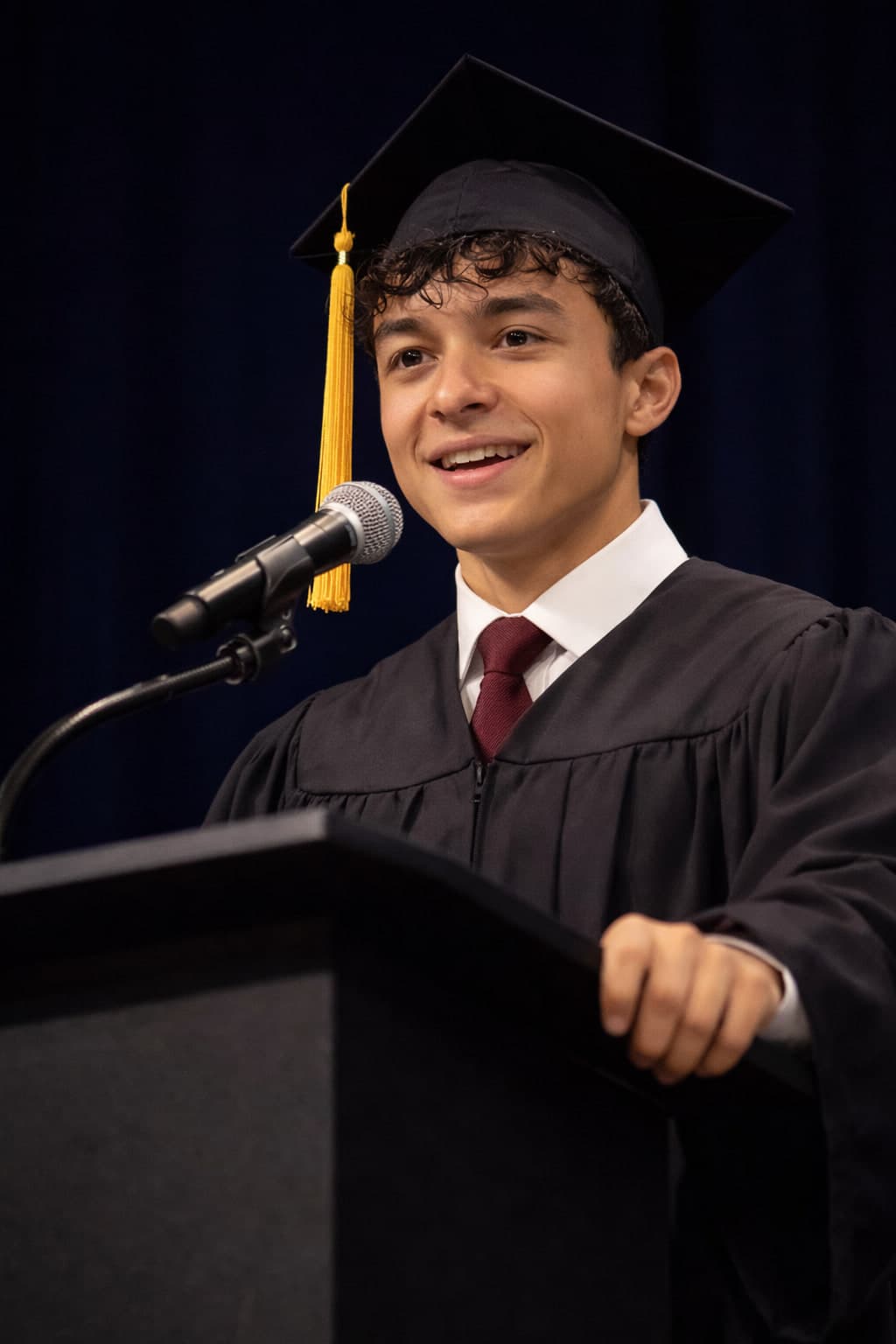 Giulianno Vollmer speaking at graduation